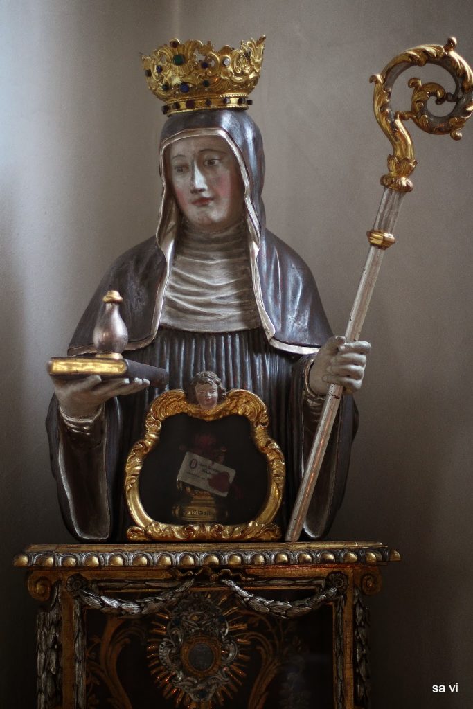 St. Walpurga with a vial of her holy bone-drippings.